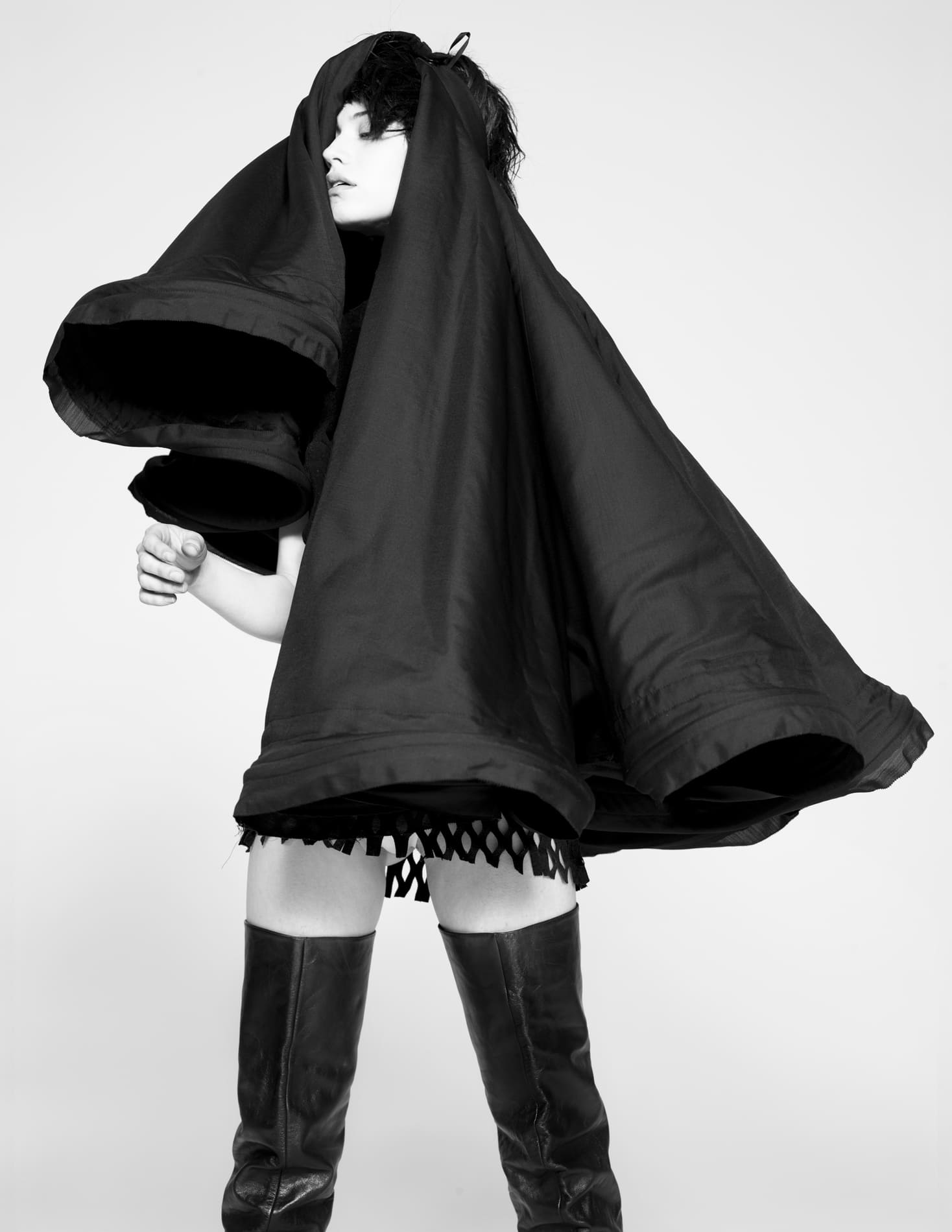 YOHJI YAMAMOTO HOOP SKIRT, 1999, (worn back to front as headpiece).