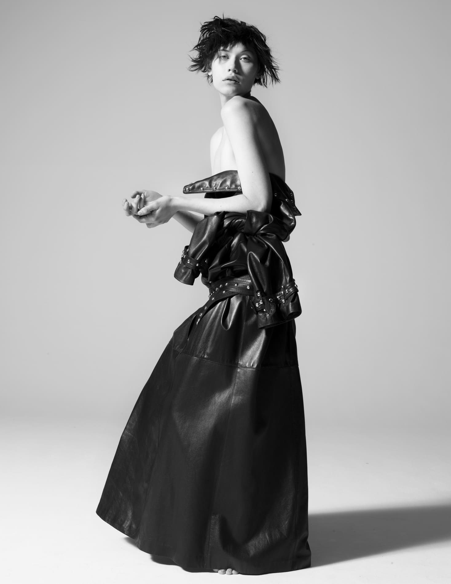 YVES SAINT LAURENT RIVE GAUCHE LEATHER TRENCH COAT, LATE '70S, (worn back to front as a dress).